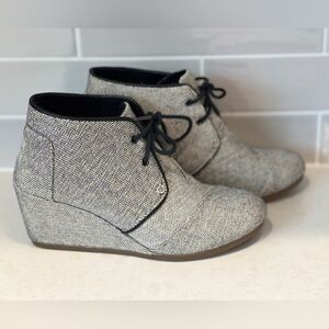 Tom’s lace up booties 
Ankle high 
Size 8
Gold and black wedge shoes